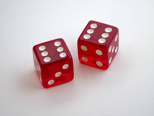 Two red dice with side "six" facing up.
